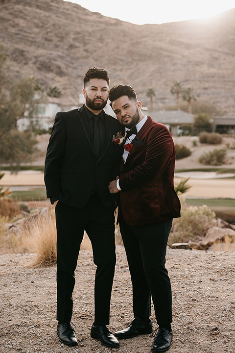  grooms in the same cobalt blue suit with 2 different color ties 