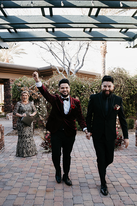  grooms in the same cobalt suit with 2 different color ties 