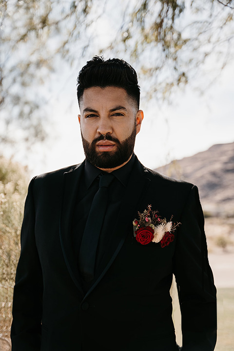  grooms in the same cobalt suit with 2 different color ties 