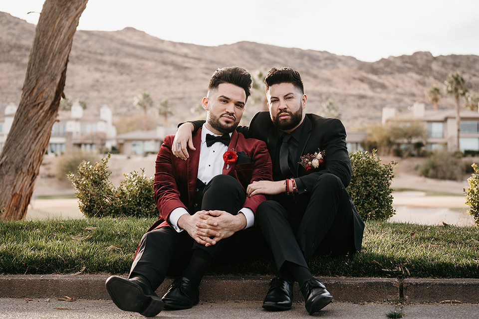 grooms in the same grey suit with 2 different color green ties