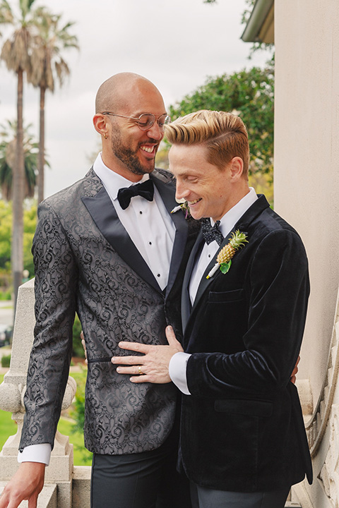 grooms in the same cobalt suit with 2 different color ties 