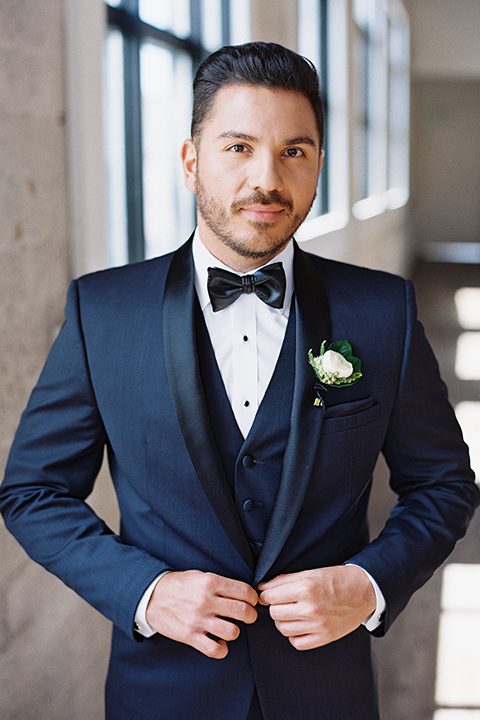  grooms in the same cobalt suit with 2 different color ties 