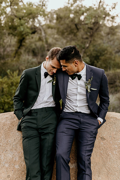  grooms in the same cobalt blue suit with 2 different color ties 