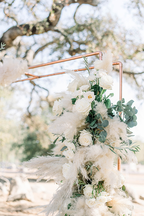 ceremony arch made of copper and florals