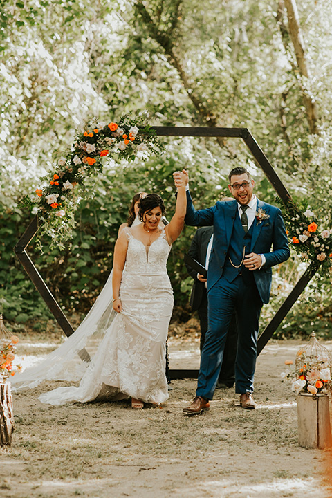  dreamy fall wedding bride and groom at ceremony 