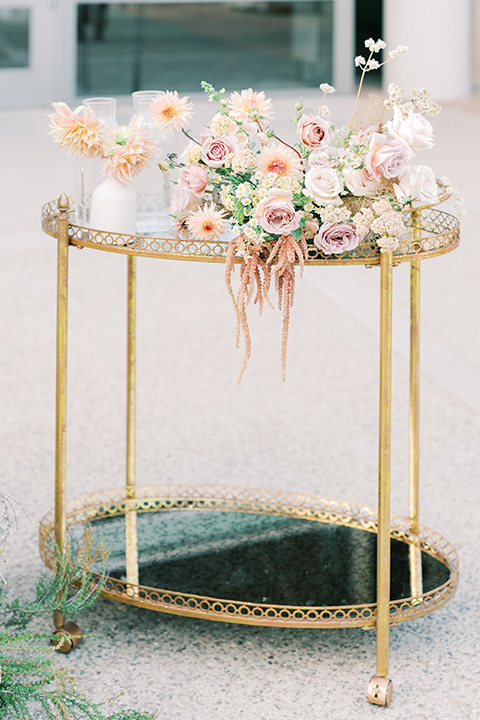  stunning chic pink and yellow wedding very french inspired, there is a pink bar with custom cocktails and a gold bar cart 
