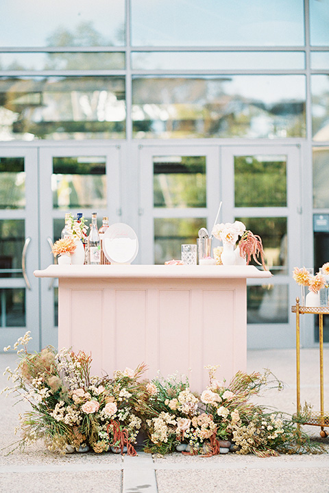  stunning chic pink and yellow wedding very french inspired, there is a pink bar with custom cocktails and a gold bar cart 