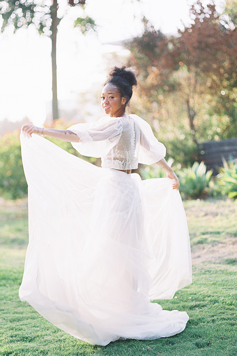  stunning chic pink and yellow wedding very french inspired, the bride is in a soft flowing gown with flutter sleeve and floral appliques 