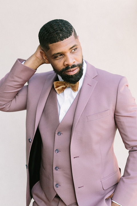  stunning chic pink and yellow wedding very french inspired, groom in a rose pink suit with a gold velvet bow tie