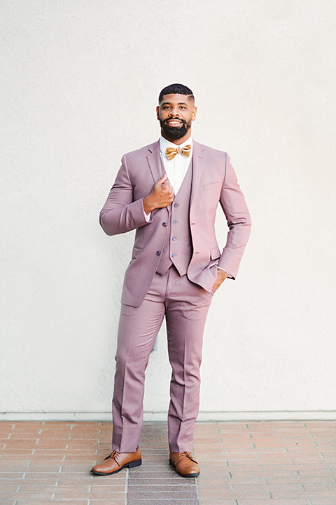  stunning chic pink and yellow wedding very french inspired, groom in a rose pink suit with a gold velvet bow tie