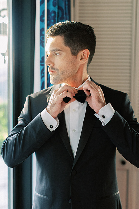  groom wearing black notch lapel tuxedo