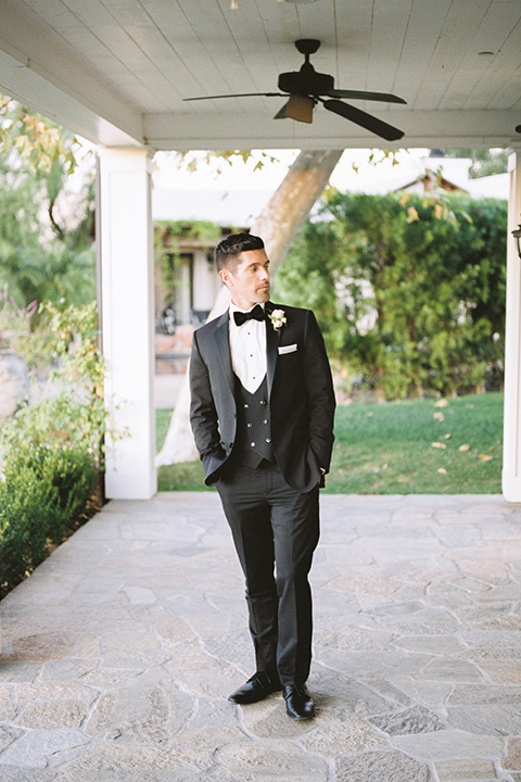  groom wearing black notch lapel tuxedo