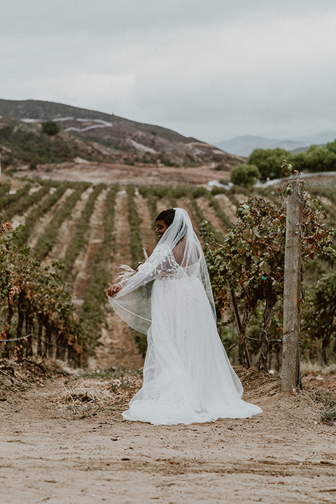  Letitia and Zach’s romantic vineyard burgundy + rose wedding – bride in her lace gown with long sleeves 