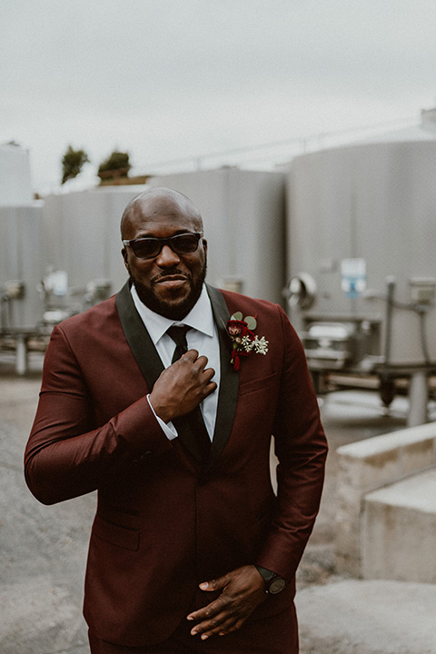  Letitia and Zach’s romantic vineyard burgundy + rose wedding – bride in her lace gown with long sleeves and the groom in a burgundy shawl lapel tuxedo 