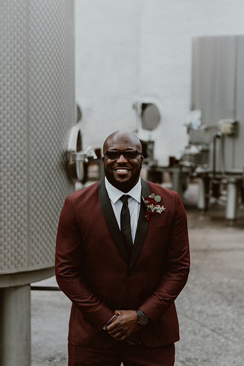  Letitia and Zach’s romantic vineyard burgundy + rose wedding – bride in her lace gown with long sleeves and the groom in a burgundy shawl lapel tuxedo 