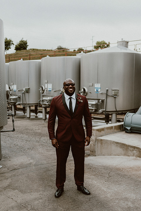  Letitia and Zach’s romantic vineyard burgundy + rose wedding – bride in her lace gown with long sleeves and the groom in a burgundy shawl lapel tuxedo