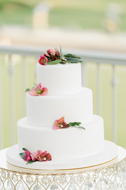  one bride in a black women’s tuxedo with a black diamond shaped bow tie