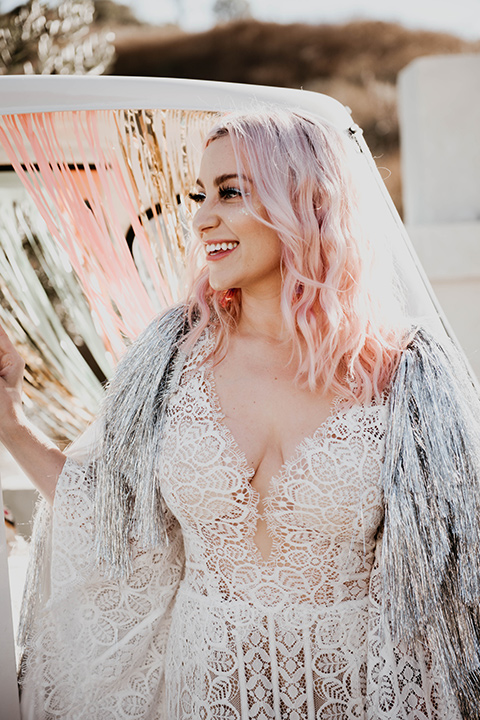  the bride in a fun sequin gown with a faux fur coat