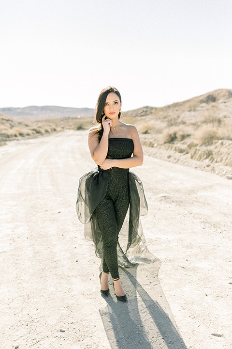  bride in a black jumpsuit with a tulle overlay 