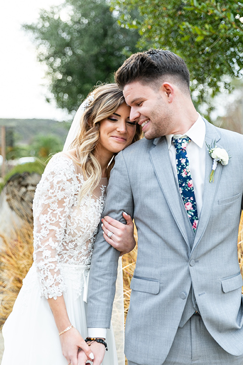  blue and red rustic garden wedding – bride and groom walking