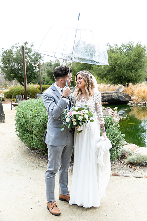  blue and red rustic garden wedding – bride and groom walking