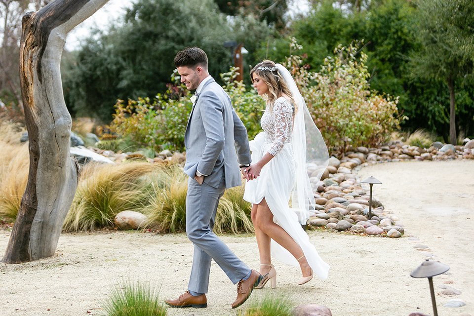  garden California floral wedding – couple walking 