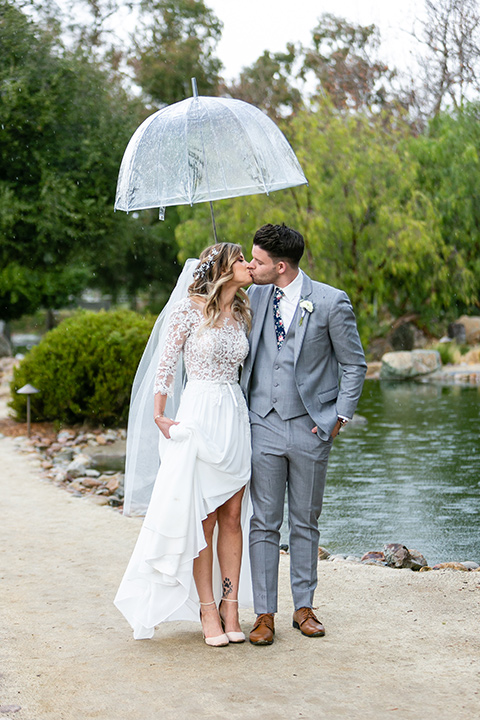  blue and red rustic garden wedding – bride and groom walking