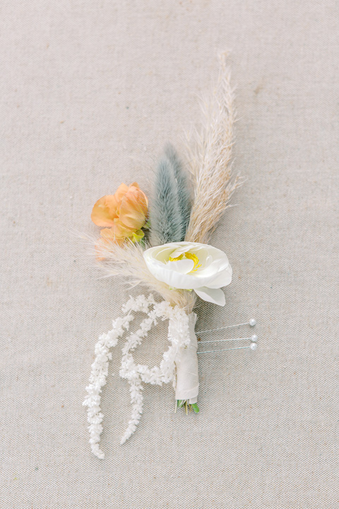  skyline dream with the bride in a formfitting lace gown and the groom in a tan suit