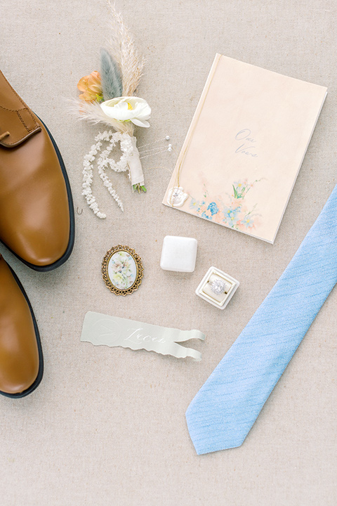  skyline dream with the bride in a formfitting lace gown and the groom in a tan suit 