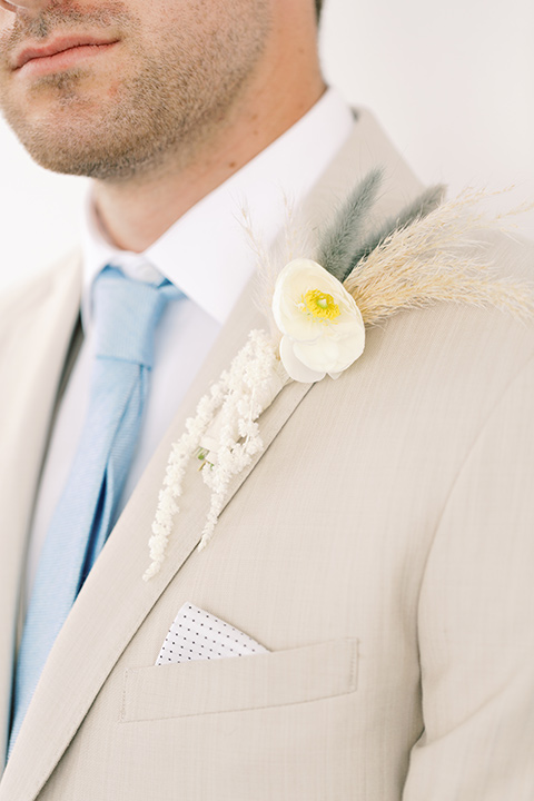  skyline dream with the bride in a formfitting lace gown and the groom in a tan suit