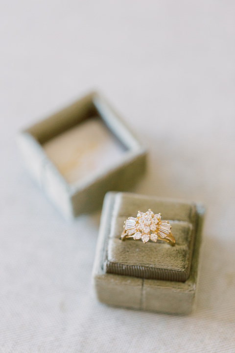  skyline dream with the bride in a formfitting lace gown and the groom in a tan suit 