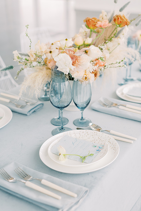  skyline dream with the bride in a formfitting lace gown and the groom in a tan suit 