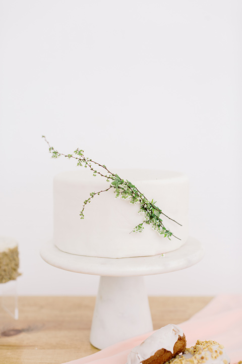  skyline dream with the bride in a formfitting lace gown and the groom in a tan suit