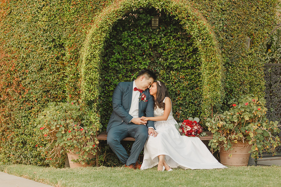  red and blue farmhouse wedding – couple sitting 