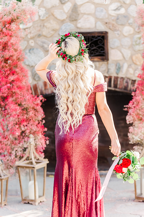  bridesmaid in a red velvet long gown and a floral headpiece