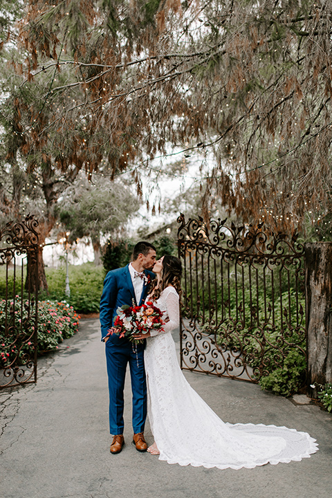  bohemian orange wedding – couple kissing 