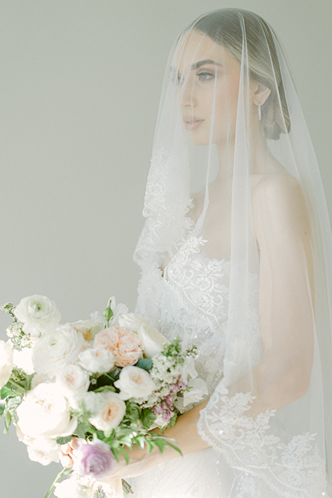  bride in a modern a line gown with a tulle skirt 