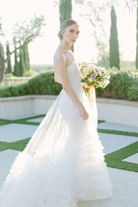  bride in a modern a line gown with a tulle skirt