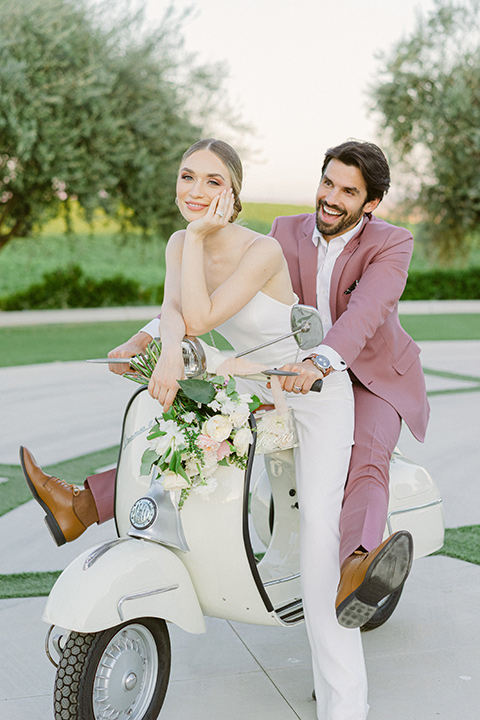  bride in a modern a line gown with a tulle skirt and the groom in a navy shawl lapel tuxedo 