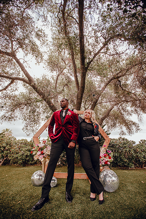  micro airbnb wedding with the bride and groom in suits – couple at ceremony arch
