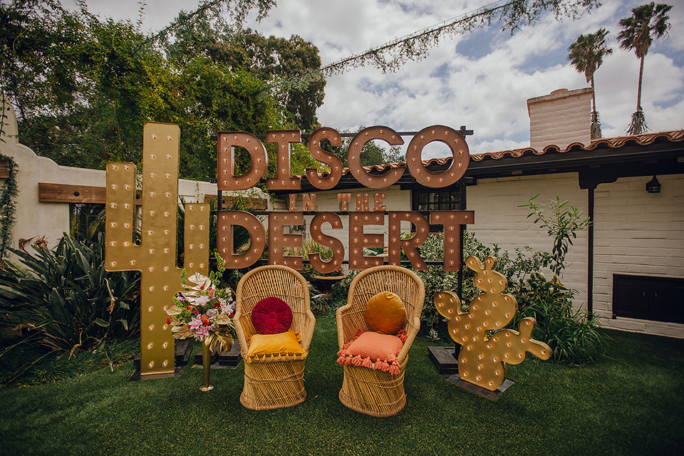  micro airbnb wedding with the bride and groom in suits – couple by disco decor