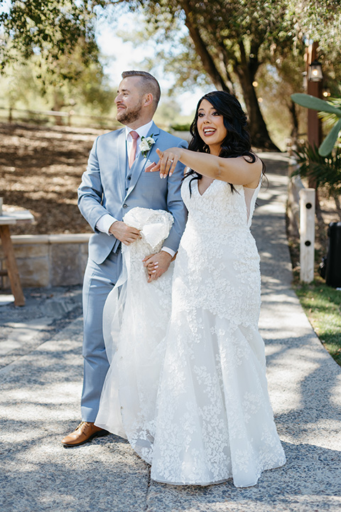  blush and blue wedding – couple walking into the reception