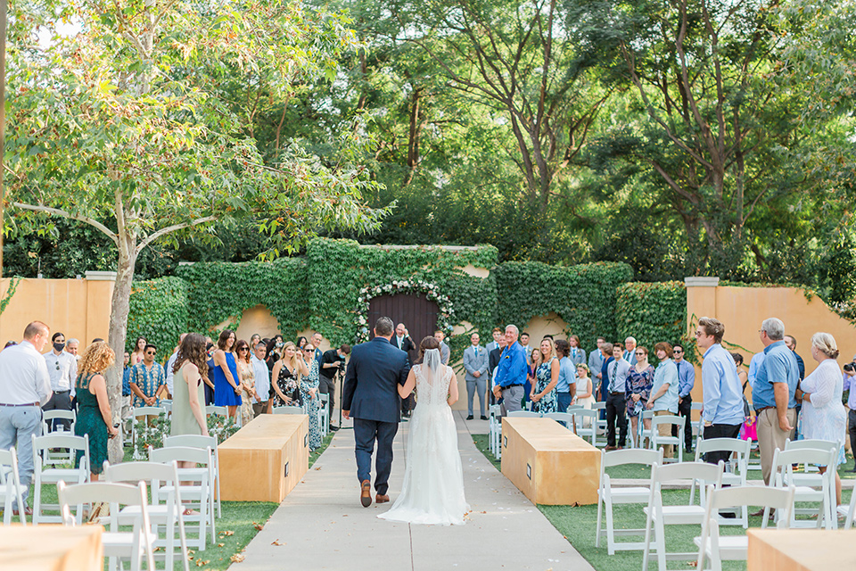  baseball inspired wedding with light blue and white details – bride walking down the aisle 