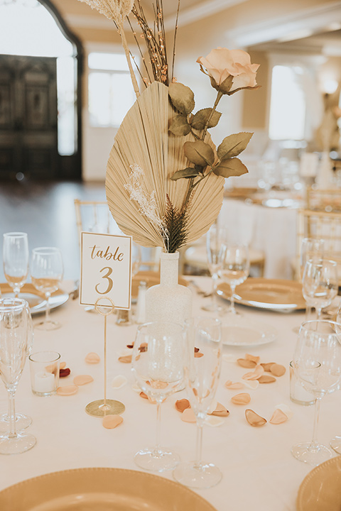  A dreamy amber toned wedding in Arizona at a wedgewood wedding venue – with the bride in a long sleeve lace gown and the bridesmaids in burnt orange dresses and the groom in a café brown suit and the groomsmen in a tan suit – table setting 