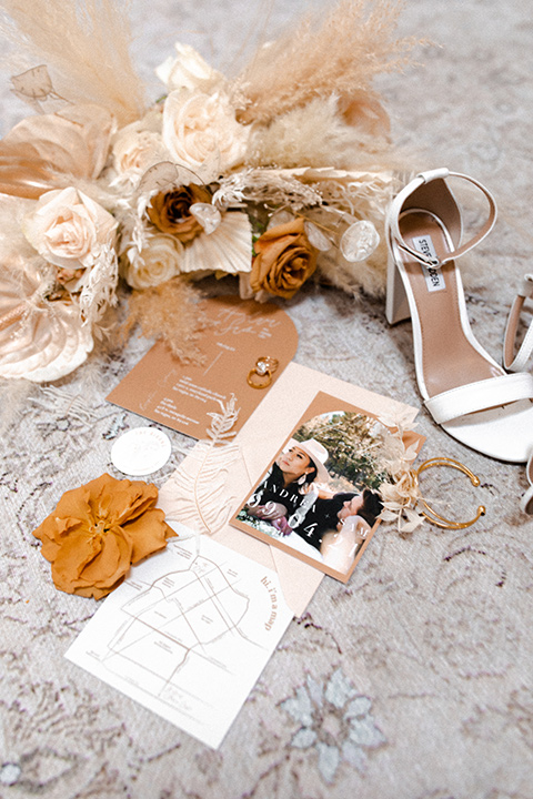  music inspired retro wedding with the bride in a lace gown and the groom in a green suit 