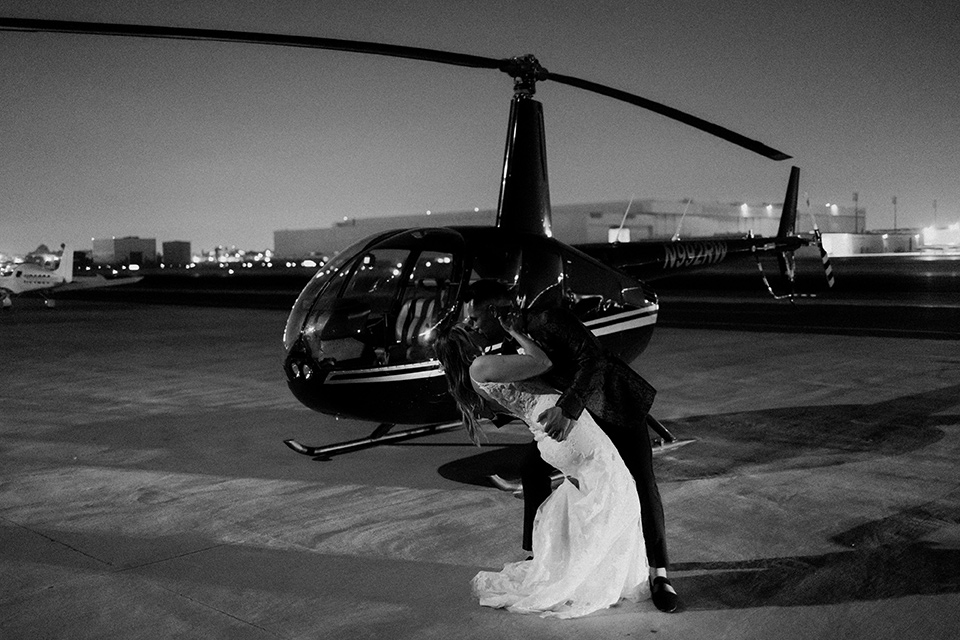  black + neutral modern wedding – couple with helicopter