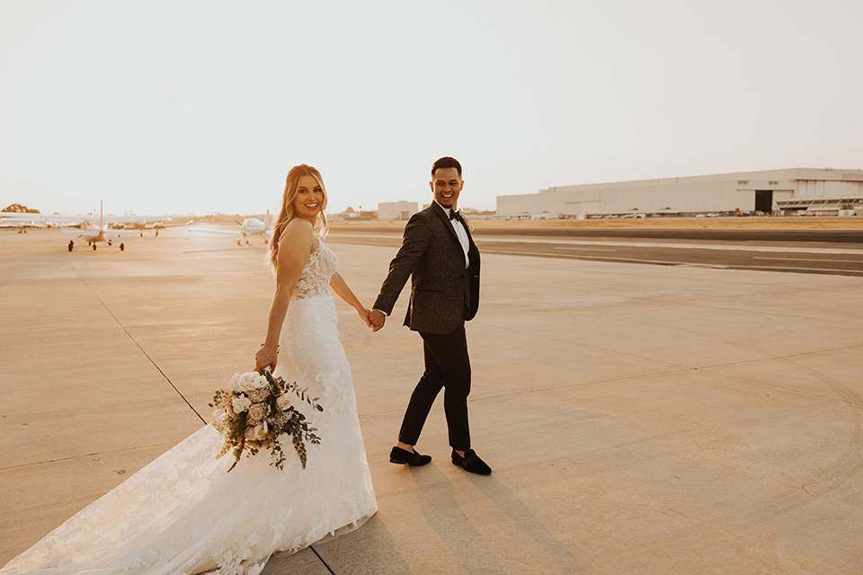  black + neutral modern wedding – couple walking