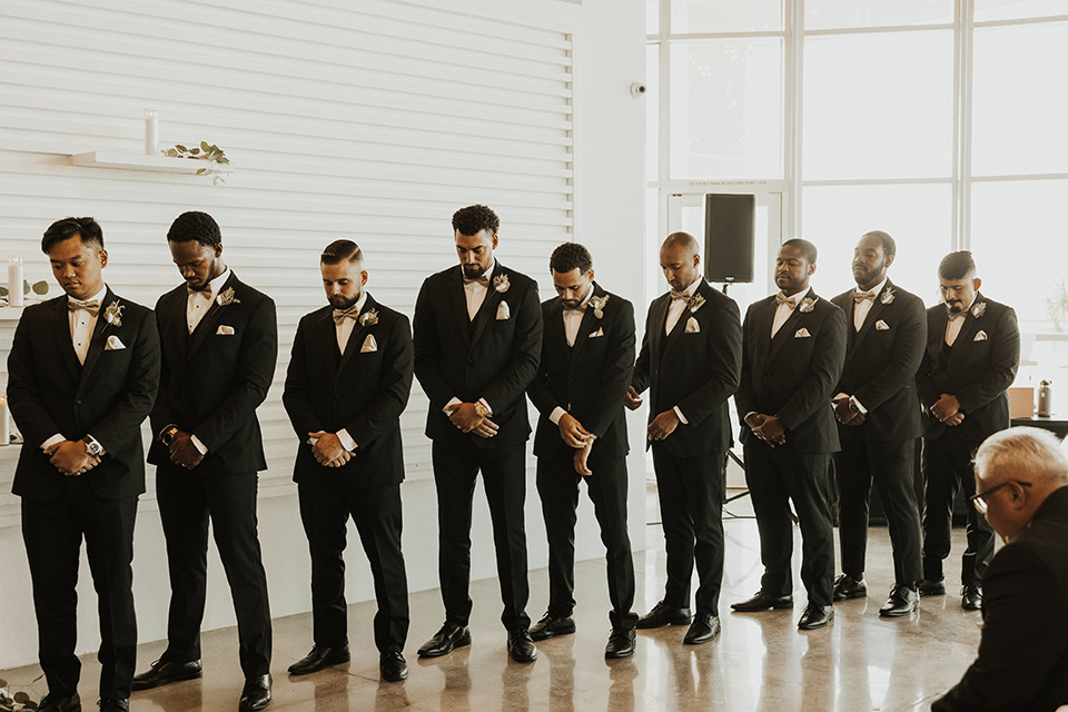  black + neutral modern wedding – groomsmen at ceremony