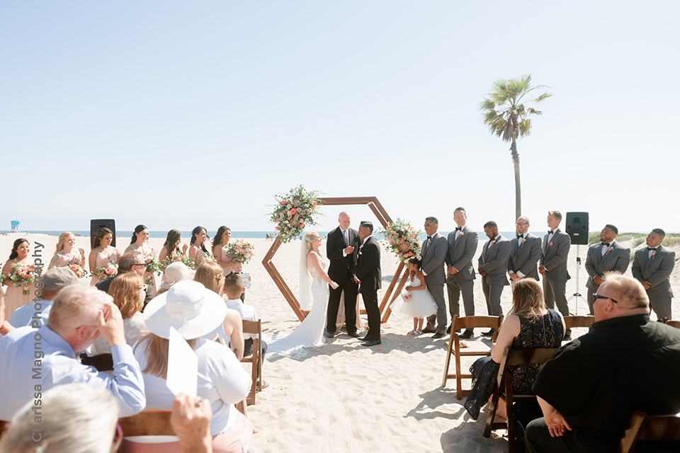  rustic boho wedding with warm colors and the bride in an off the shoulder gown and the groom in a caramel suit 