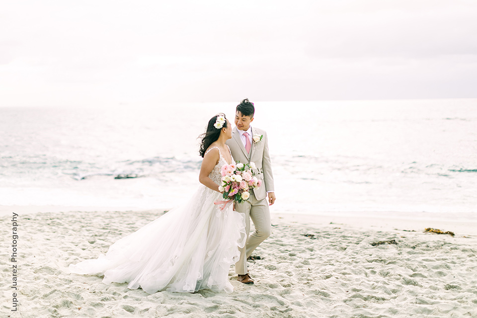  rustic boho wedding with warm colors and the bride in an off the shoulder gown and the groom in a caramel suit 